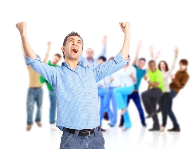 Group of happy people hugging and cheering